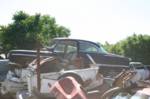 Oldsmobile 98 stacked in a junkyard