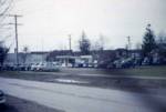 Some neat pictures of an old corner car lot, new and used.